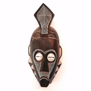 Decorative Carved Wood Tribal Mask with hook on back. Measures 12.5”x5.5”.